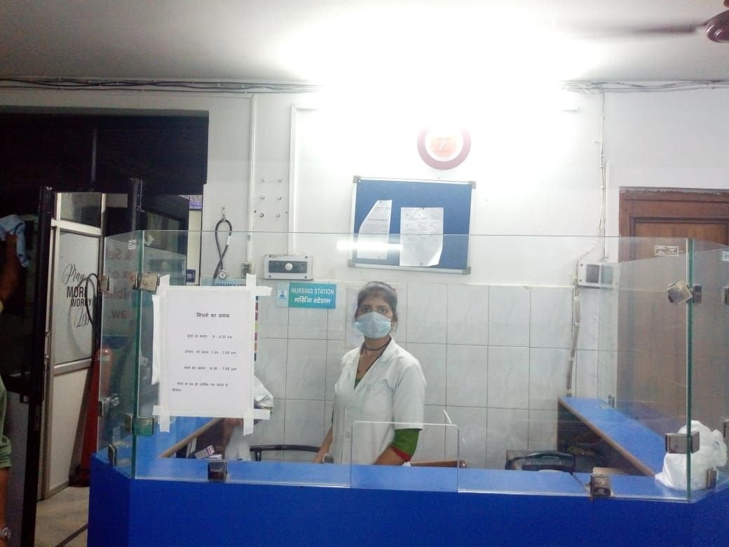 A trained nursing assistant on duty at a hospital nursing station