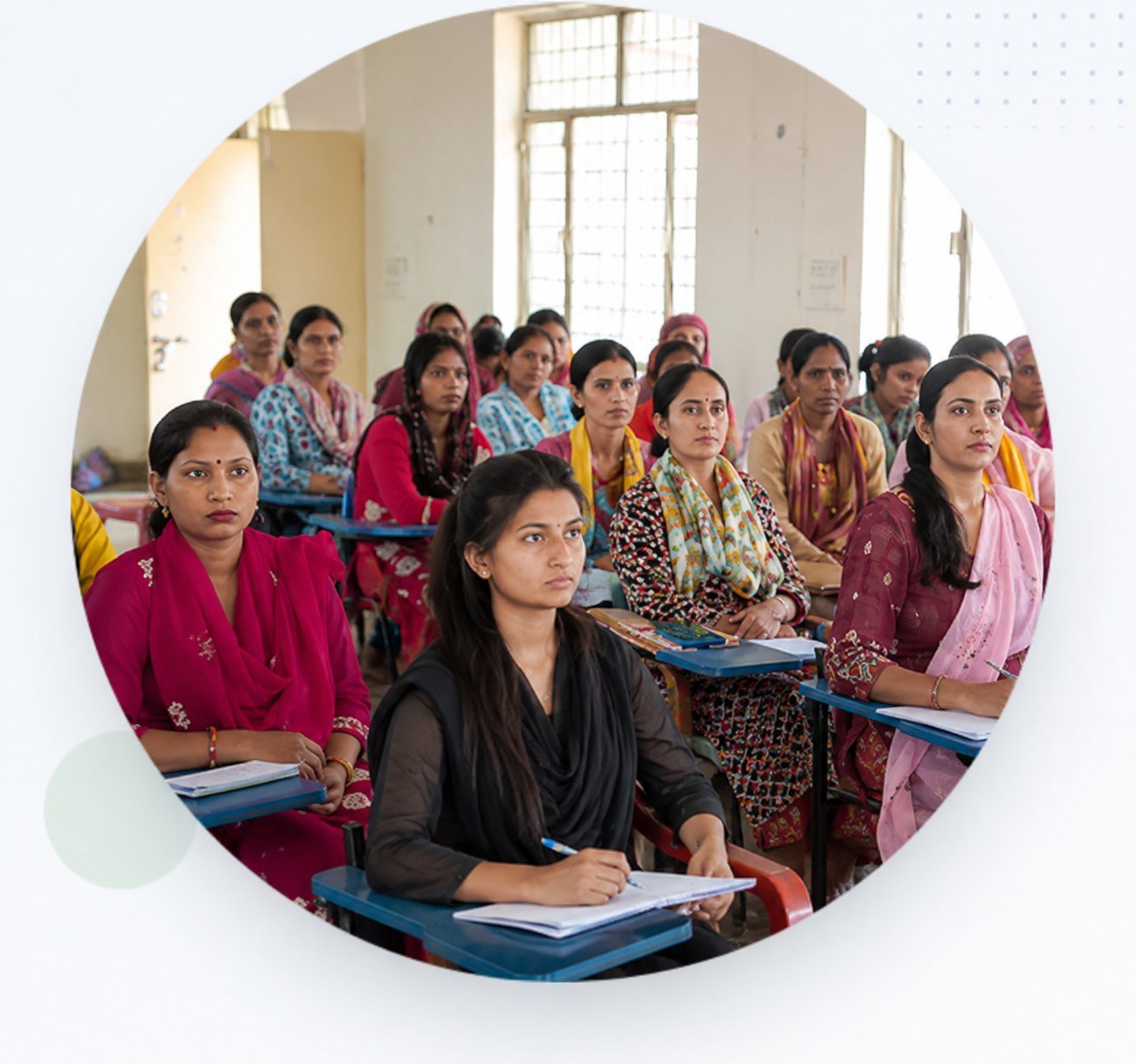 Women candidates seated at desks during a training session at an IIEWS centre