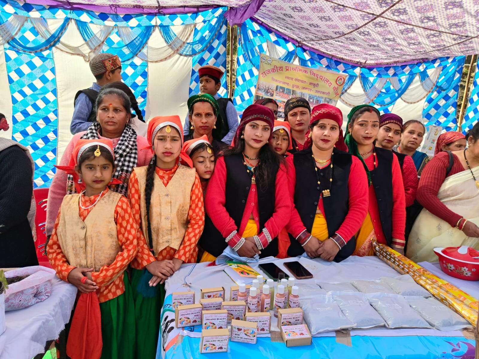 Self-help group women presenting their organic soap products at a district exhibition