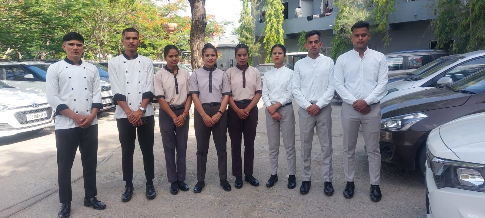 Hotel management trainees in uniform after placement