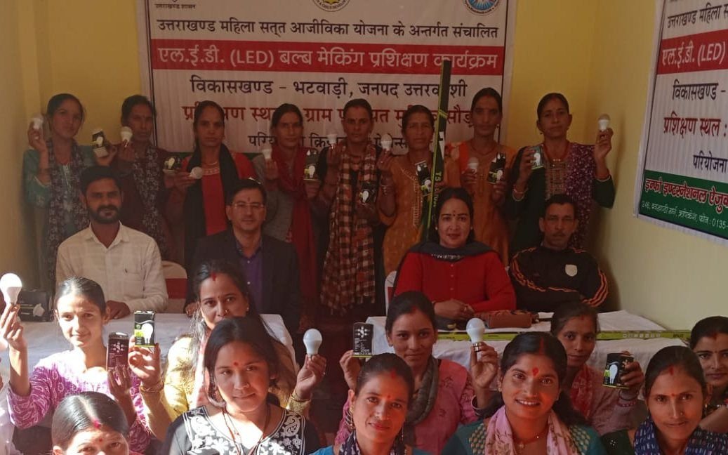 A large gathering of women at the inauguration of an LED bulb making programme